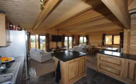 Luxury chalet log cabin interior with open plan kitchen and lounge, Torwood Country Lodges