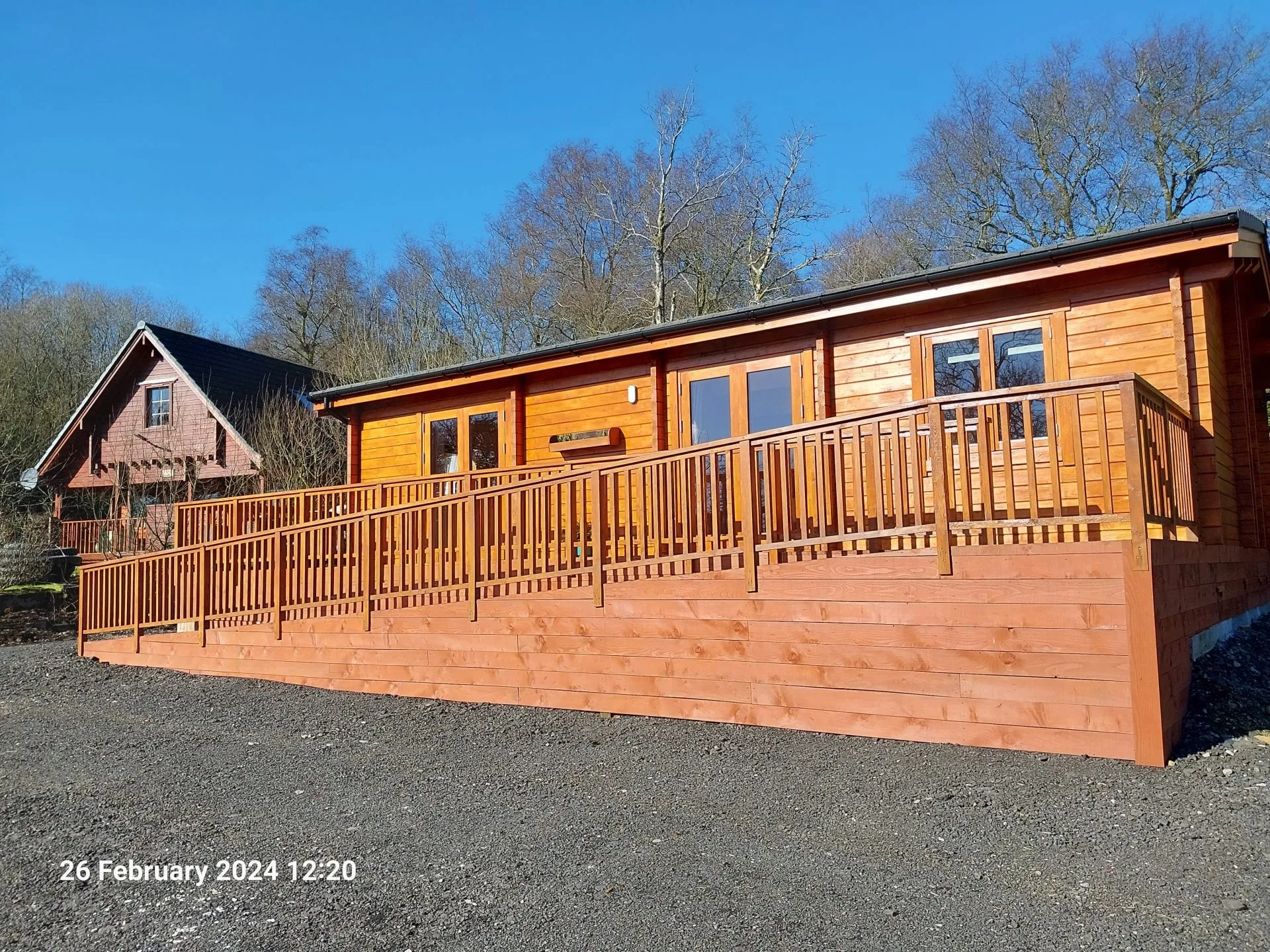 Little Lodge exterior with wraparound decking, Torwood Country Lodges, Newton Stewart