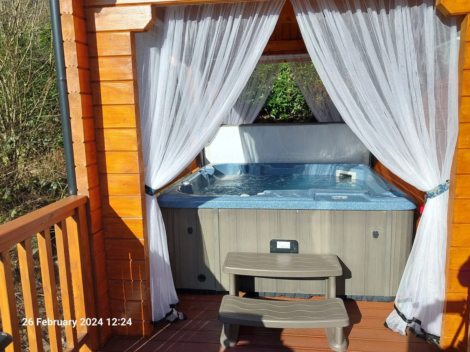 Covered private hot tub at Little Lodge, Torwood Country Lodges