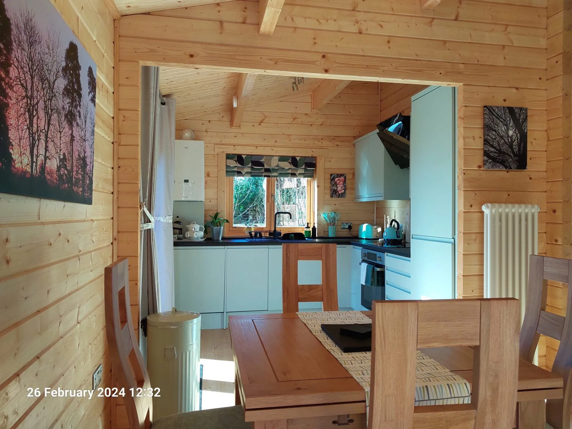 Kitchen and dining area with radiator in Little Lodge, Torwood Country Lodges, Newton Stewart