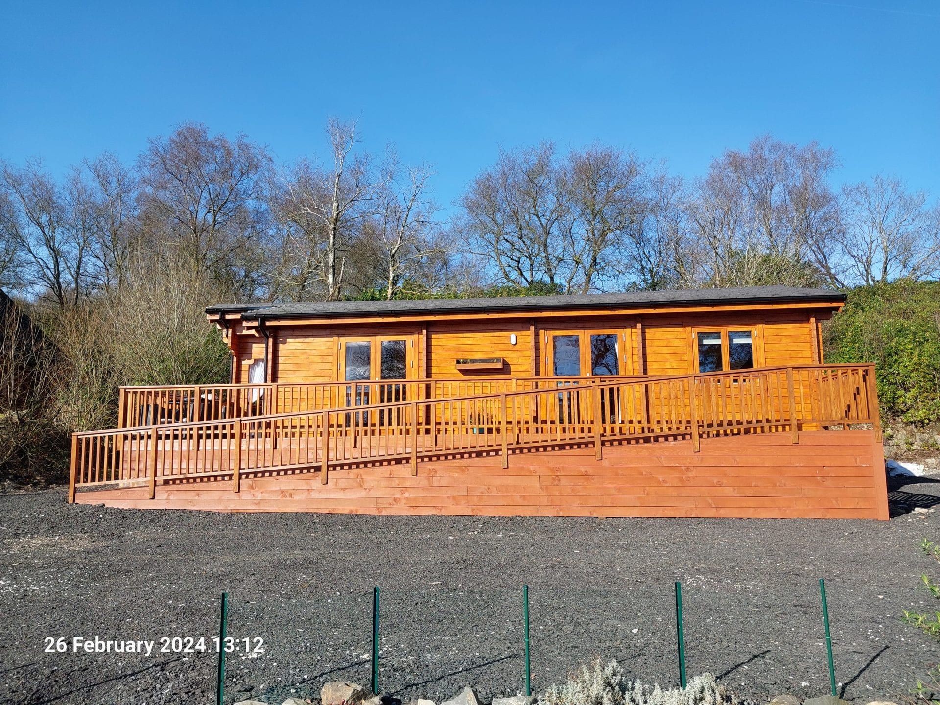 Timber lodge on its plot at Torwood Country Lodges, Dumfries and Galloway