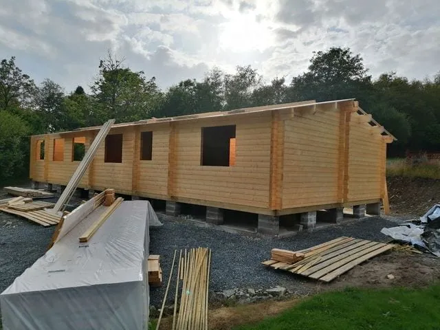 Solid timber lodge under construction at Torwood Country Lodges